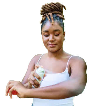 woman spraying herself with product